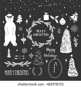 Collection of handdrawn winter design elements. Holiday set with bear, snowflakes, wreath, toys, tree, Merry Christmas lettering.