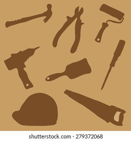 Collection of images of silhouettes of working tools on a brown background
