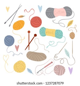 A collection of items for knitting. Threads and knitting needles on a white background, balls of yarn