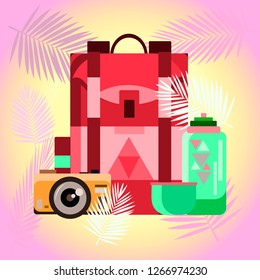A collection of items for travel. Tourist complex. Hiking backpack, mug, camera. Against the background of fern leaves.