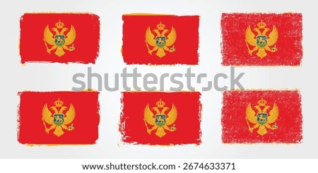 Collection of Montenegro flags depicted in textured brush style, showing red fields with golden borders and a central crowned eagle emblem.
