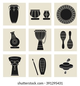 Colección de nueve instrumentos de percusión. Siluetas negras de conga, tablas indias, daf drum, maracas, djembe, udu, guiro, cimbals y doumbek.