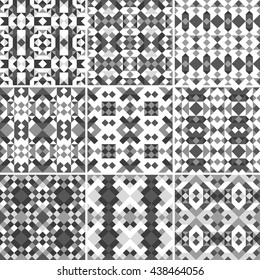 Collection of nine vector seamless geometrical patterns in black, grey and white colors. Set of endless backgrounds of triangles. Decorative abstract universal texture