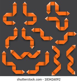 Collection of the orange origami arrows on the gray background