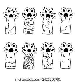 A collection paws of a cat. Various cartoon paws. Funny furry paws, sharp claws. line art