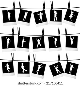 Collection of photo frames hanging on rope with children silhouettes
