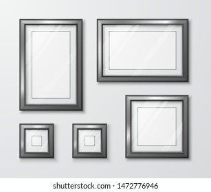 Collection of photo frames on the gray wall. Modern empty frame template with transparent glass and shadow. Vector illustration 