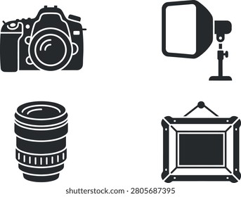 A collection of photography equipment including a camera, lens, light source, and frame