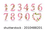 Collection of pink numbers decorated with roses, leaves, branches