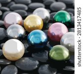 A collection of shiny glass marbles in bright colors including blue green yellow pink and white
