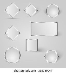 collection of shiny silver, steel, badges with shadows