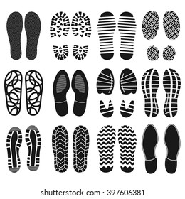 The collection of a shoeprints. Shoes silhouette black and white icons. Imprint of the soles with the differing patterns. Vector eps10