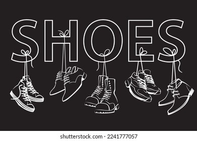 collection of shoes hanging on shoelaces isolated black background