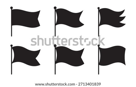 Collection of silhouetted waving flags on poles