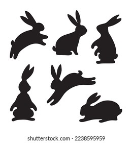 A collection of silhouettes of cute Easter bunnies. Black rabbit, wild hare, highlighted on a white background. Greeting card for children's party, vinyl sticker, pet sticker. Vector  in flat style