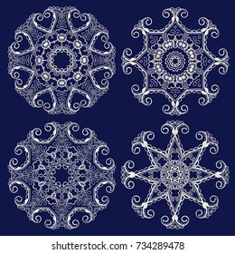 Collection of silver mandalas, design elements on a black background.Set of vector snowflakes