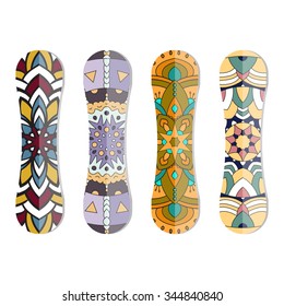 Collection of snowboards with geometric color pattern on a white isolated background.