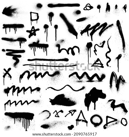 Collection of spray paint splatters. Grunge graffiti on the wall. Traces from a spray of paint.