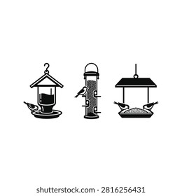 A collection of three distinct bird feeders, each with birds perched and consuming seeds.