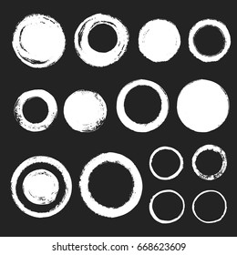 Collection of various chalk or brush drawn circles. Set of graphic elements. Round hand drawn different frames or brush strokes with rough, uneven edges.