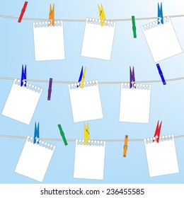 Collection of various notes and a clothes pegs. Clothespins on a clothesline.