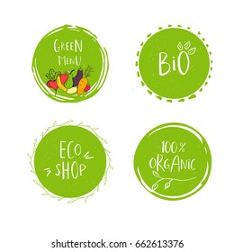 Collection of vector eco, bio green logo or sign. Vegan, raw, healthy food badge, tag for cafe, restaurants, products packaging. Hand drawn leaves, branches with lettering. Organic design.