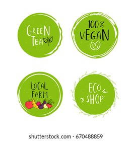 Collection of vector eco, bio green logo or sign. Vegan, raw, healthy food badge, tag for cafe, restaurants, products packaging. Hand drawn leaves, branches with lettering. Organic design.