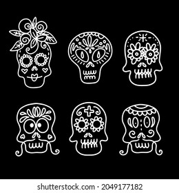 Collection of vector linear illustrations of decorated skulls of different types on black background for Halloween celebration concept designs