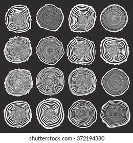 Collection of vector tree rings background and saw cut tree trunk. Conceptual graphics. White on dark background