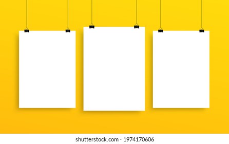 Collection of vertical hanging poster mockup, white blank sheets template on yellow wall