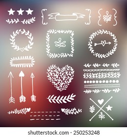 Collection of vintage floral elements on blurred background.