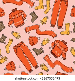 A collection of warm, cozy clothes and shoes. Seamless pattern. Cold season: autumn, winter. Vector illustration in doodle style.