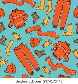 A collection of warm, cozy clothes and shoes. Seamless pattern. Cold season: autumn, winter. Vector illustration in doodle style.