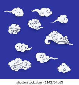 Collection of white asian clouds. Set of paper cut cartoon clouds in traditional chinese style. Vector illustration for design elements for branding decoration, background, cover, poster