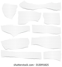 collection of white lined scraps of papers with shadows