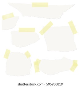 Collection of white scraps of paper with colored tape