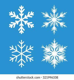 Collection of White Snowflakes and Blue Background.
