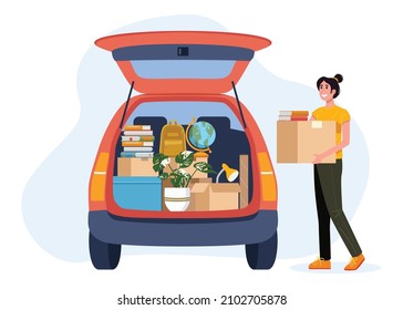 College Student Packing Car And Moving Into Dormitory Or Apartment.