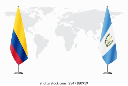 Colombia and Guatemala flags for official meeting against background of world map.