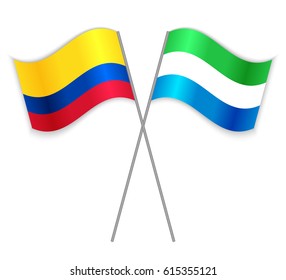 Colombian and Sierra Leonean crossed flags. Colombia combined with Sierra Leone isolated on white. Language learning, international business or travel concept.