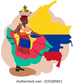 A Colombian woman in a national costume and with a bowl of fruit on her head stands in front of a map and flag of the Republic of Colombia.