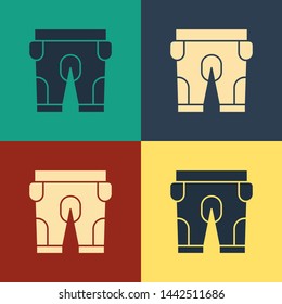 Color American football shorts icon isolated on color background. Football uniform sign. Vintage style drawing. Vector Illustration