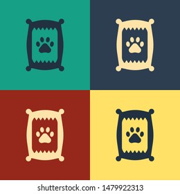 Color Bag of food for dog icon isolated on color background. Dog or cat paw print. Food for animals. Pet food package. Vintage style drawing. Vector Illustration