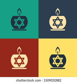 Color Burning candle in candlestick with star of david icon isolated on color background. Cylindrical candle stick with burning flame. Vintage style drawing. Vector Illustration