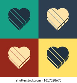 Color Candy in heart shaped box icon isolated on color background. Valentines Day. Vintage style drawing. Vector Illustration