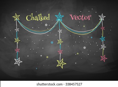 Color chalkboard drawing of Christmas garland with stars.