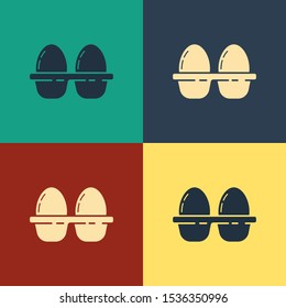 Color Chicken egg in box icon isolated on color background. Vintage style drawing. Vector Illustration
