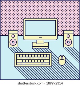 color computer, speaker and keyboard on a table