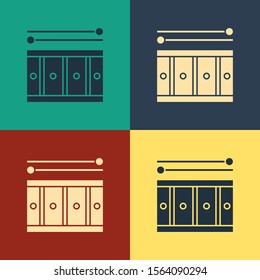 Color Drum with drum sticks icon isolated on color background. Music sign. Musical instrument symbol. Vintage style drawing. Vector Illustration