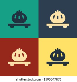 Color Dumpling on cutting board icon isolated on color background. Traditional chinese dish. Vintage style drawing. Vector Illustration